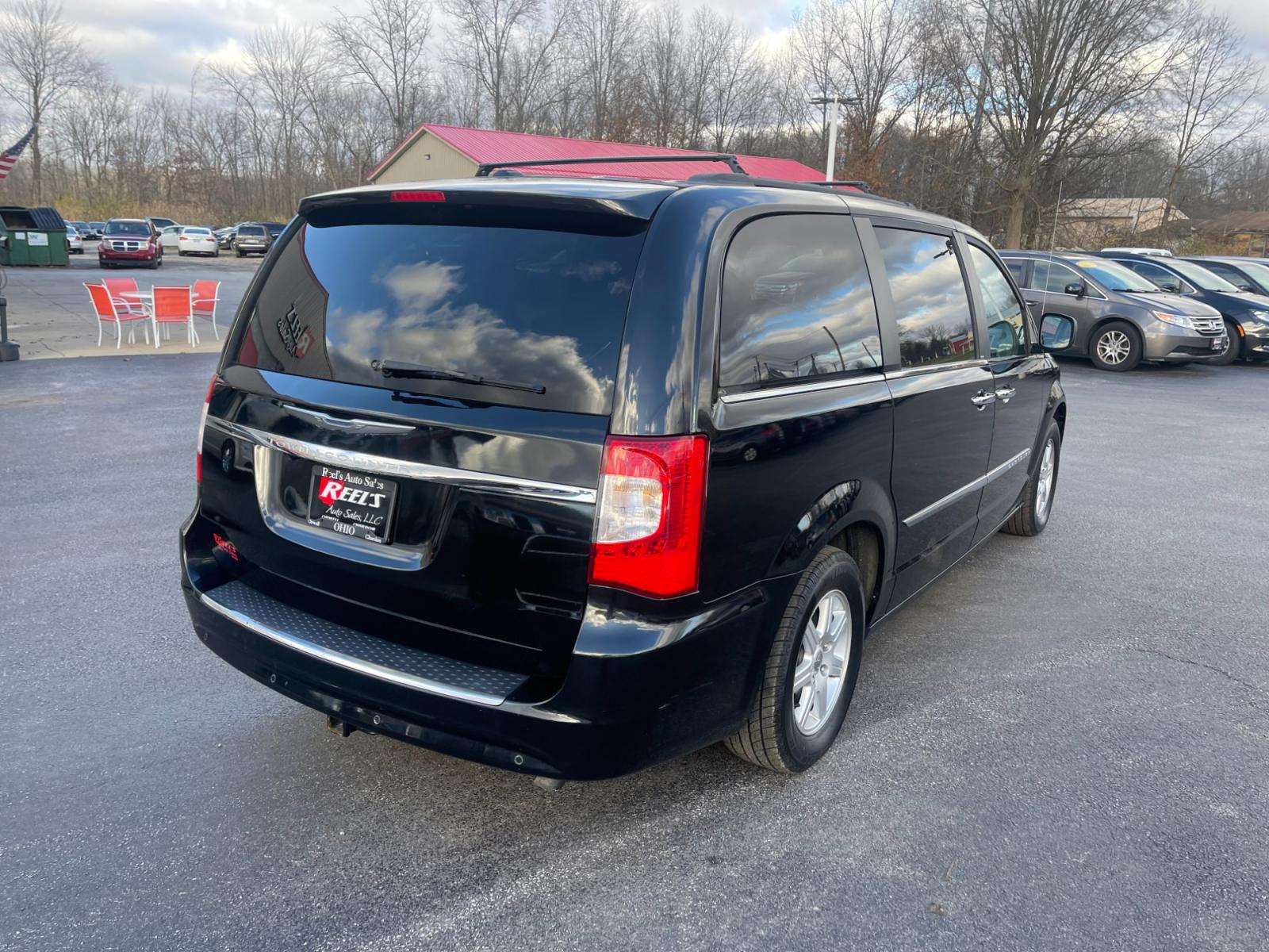 2012 Black /Black Chrysler Town & Country (2C4RC1BG0CR) with an 3.6L V6 DOHC 24V FFV engine, 6-Speed Automatic transmission, located at 11115 Chardon Rd. , Chardon, OH, 44024, (440) 214-9705, 41.580246, -81.241943 - This 2012 Chrysler Town & Country Touring - L model features a luxurious interior with cloth seats that are heated for comfort, complemented by a heated steering wheel for added warmth in cooler weather. It comes equipped with a convenient tow package, enhancing its utility for pulling trailers or b - Photo #7